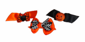 Dog hair bows for Halloween with elastics and on barrettes. 