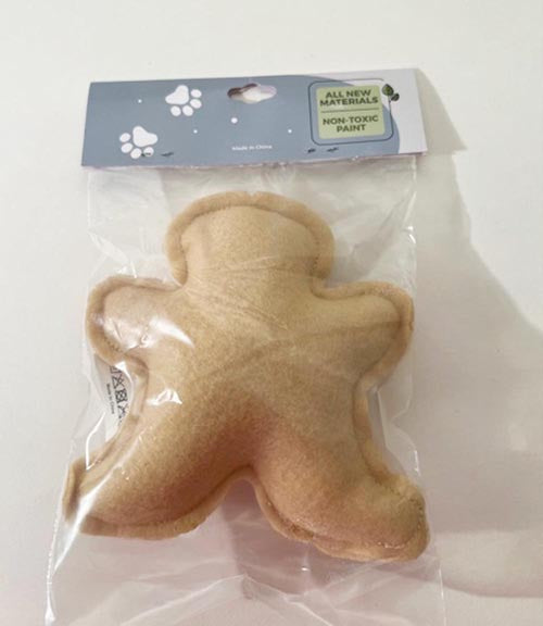 Back view of Gingerbread soft dog toy in package
