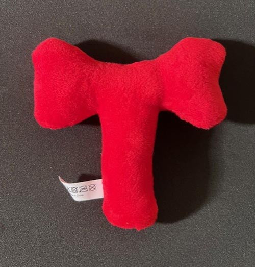 Red plush T-bone dog toy with squeaker back view