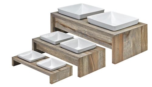 Set of white square bowls on wooden stands 