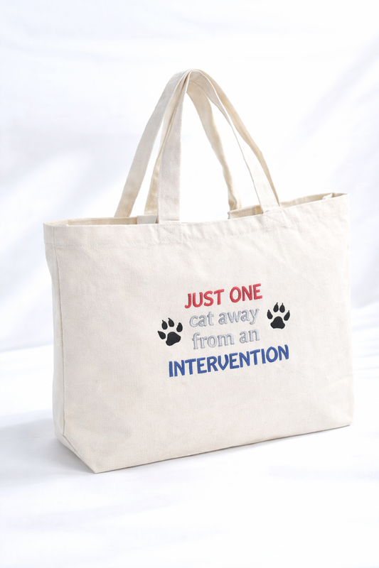 canvas tote embroidered with just one cat away from an intervention