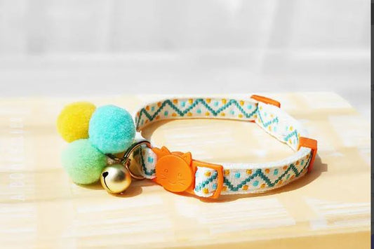 Unique Pompom Cat collar with orange quick-release buckle, pompoms and a bell